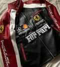 Ferrari leather jacket with branding and logos on a neutral background